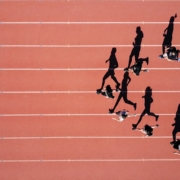 Group of people running on stadium